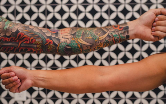arm sleeve tattoo with different colors