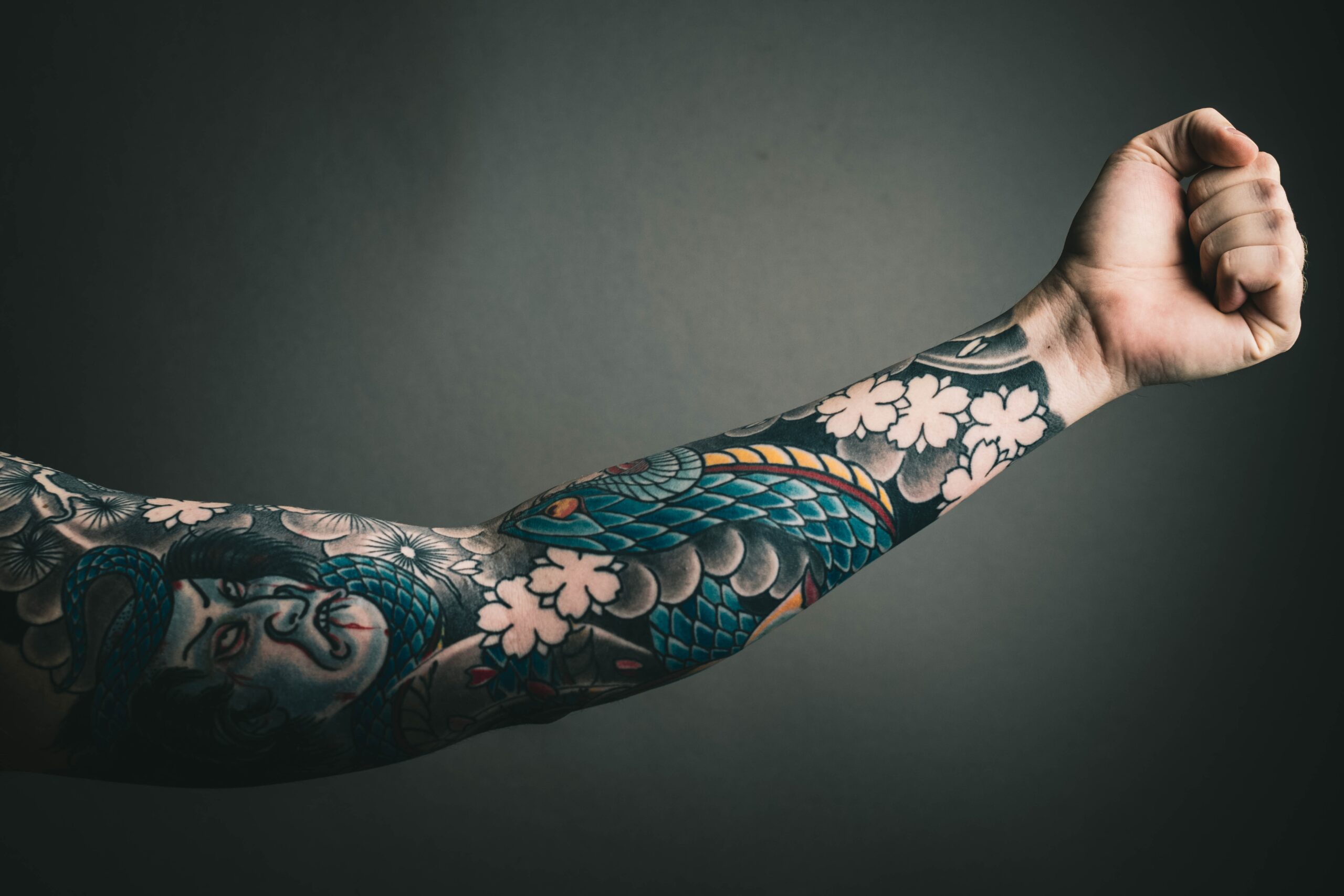 left arm sleeve colorful tattoo