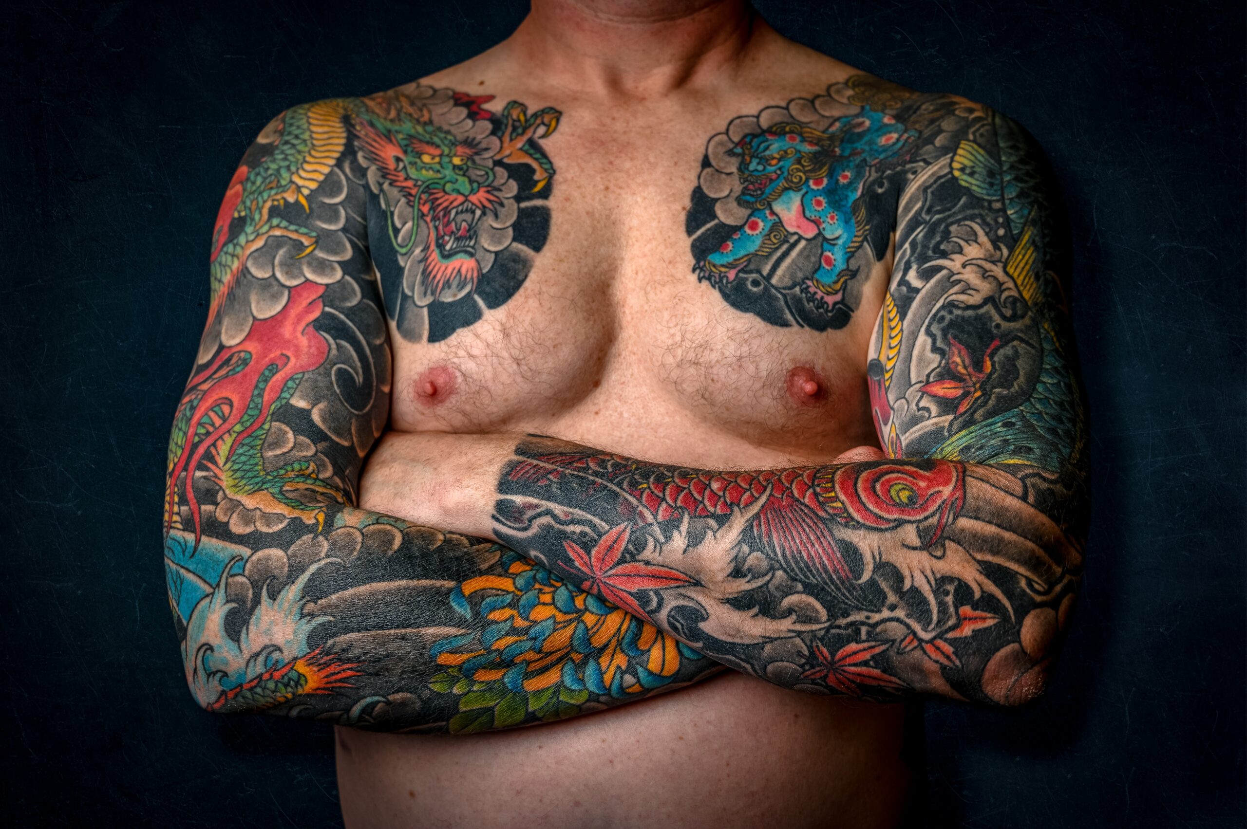 man with sleeve tattoos