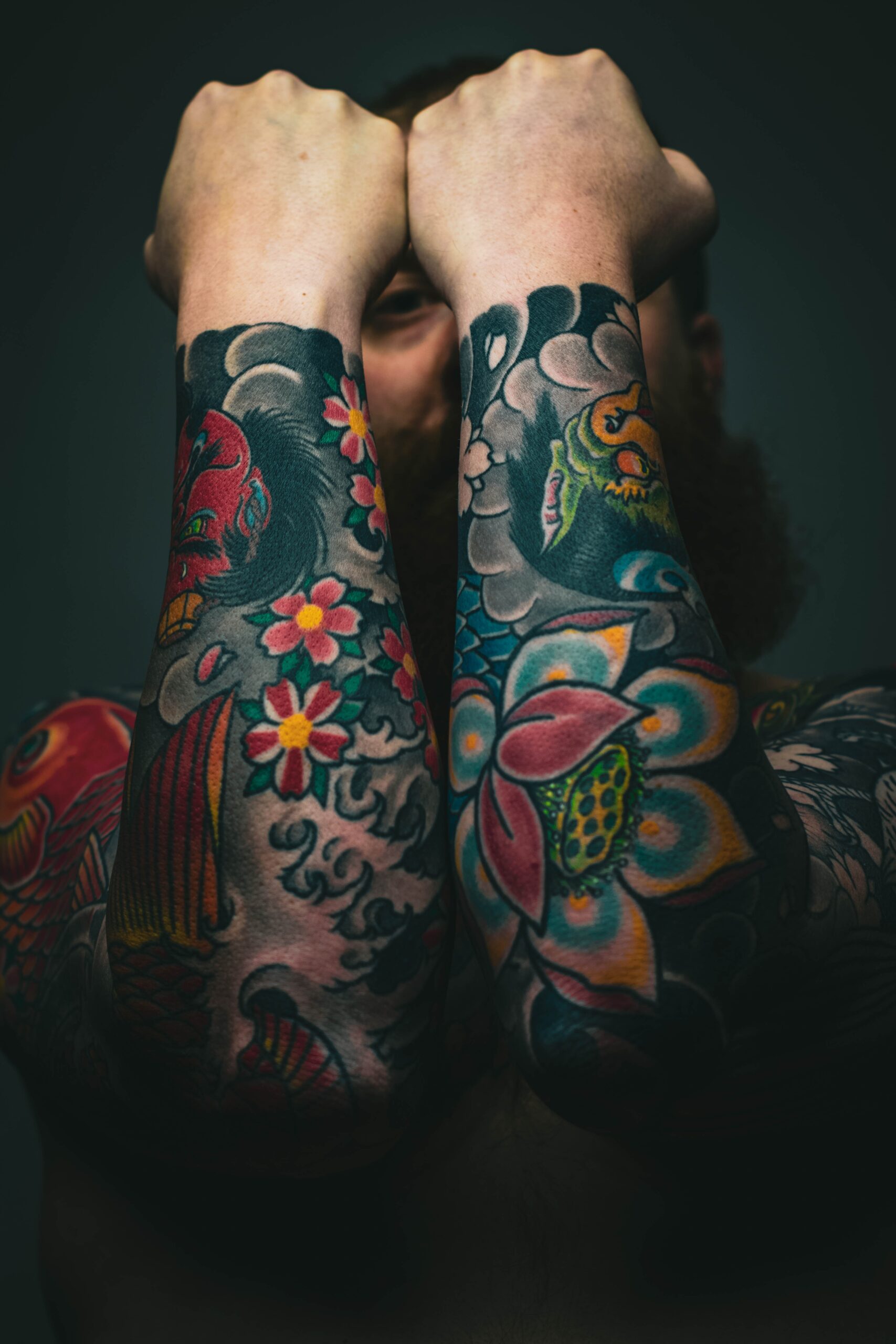 colorful tattoo on forearms